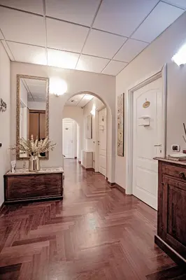 an empty hallway with a mirror and a vanity at Domus Palatina in Rome