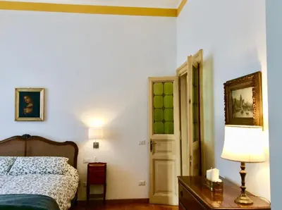 a view of a city at night with a castle at Colosseum View Exclusive Apartment in Rome