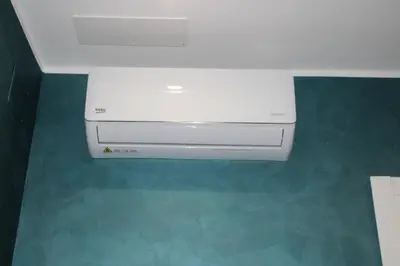 a white video game system sitting on the floor at My Rhome Prati in Rome
