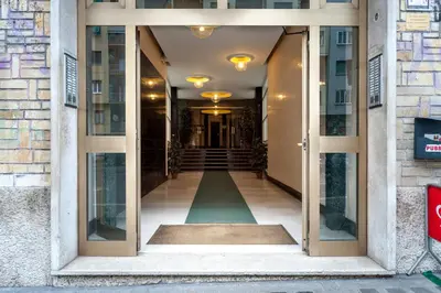 a hallway of a building with glass doors at Vatican Mami in Rome