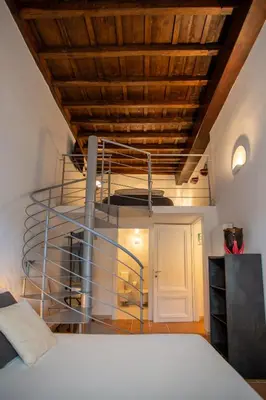 a bedroom with a bed and a wooden ceiling at PgrHome Domus Pantheon in Rome