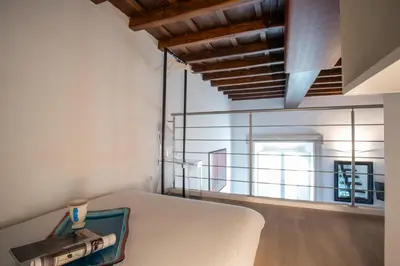 a bedroom with a bed with a suitcase on it at PgrHome Domus Pantheon in Rome