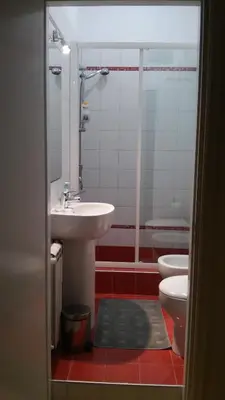 a bathroom with a sink and a toilet at Relais La Canfora in Rome