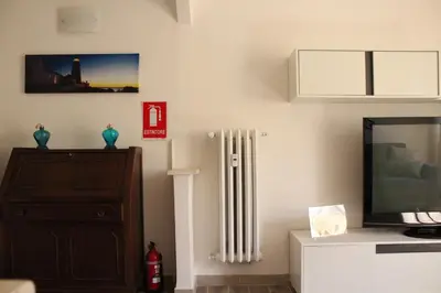 a living room with a television and a radiator at Apartment Flaminio in Rome