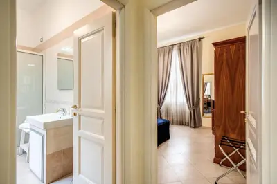 a bathroom with a sink and a mirror at Residenza Praetoria in Rome