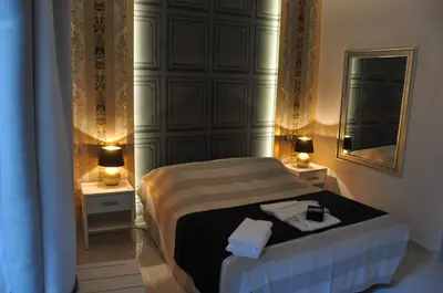 a small bedroom with a bed with two night stands at Navona Nice Room in Rome