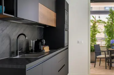 a kitchen with a sink and a counter top at Casa Scalzi in Rome