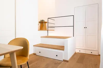 a dining room with a staircase and a table at Casa Scalzi in Rome