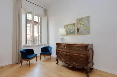 a room with two chairs and a dresser and a window at Residenza Torre Vecchiarelli - apt 3 in Rome