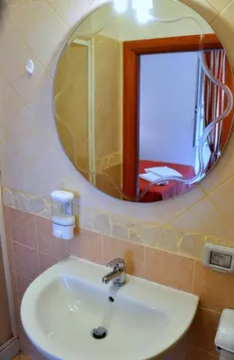 a bathroom with a sink and a mirror at Guesthouse Alex II in Rome