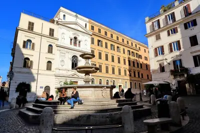 a group of people sitting in front of a fountain at Casa Santa Sofia in Rome