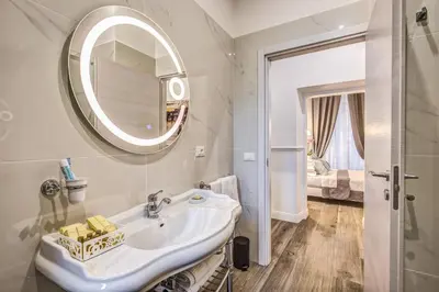 a bedroom with a bed and a couch at Piazza di Spagna Just for Us in Rome