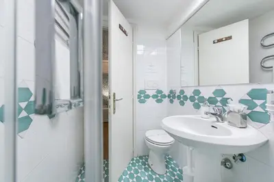 a bathroom with a sink and a toilet at Pantheon Palazzo Nari in Rome