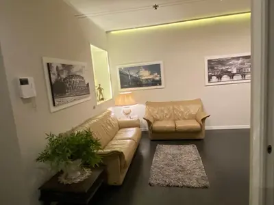 a living room with a couch and a chair at Balestra Palace Apartment in Rome