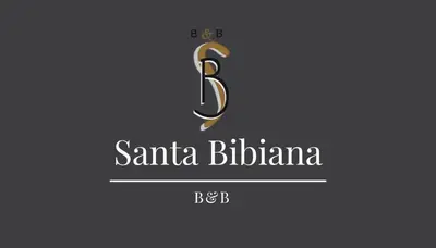 a letter b in a gold monogram on a purple background at Santa Bibiana B&B in Rome