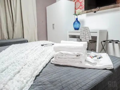 a bedroom with a bed with white towels on it at Magic Door Rome in Rome