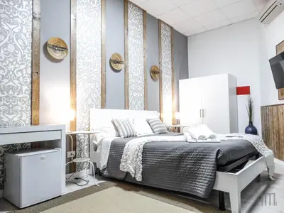 a bedroom with a bed and a tv at Magic Door Rome in Rome