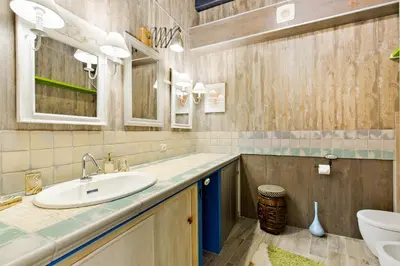 a bathroom with a sink and a toilet at Rome As You Feel - Design Apartment at Colosseum in Rome