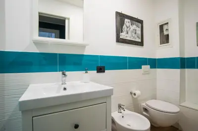 a bathroom with a sink and a toilet at Le Stanze Di Paola in Rome