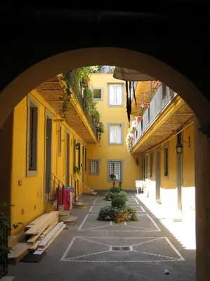 an archway in an alley between two buildings at Sweet Campo de Fiori in Rome