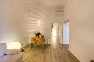 a living room with a table and a dining room at Vaticano casa tua in Rome