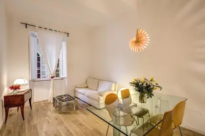 a living room with a couch and a glass table at Vaticano casa tua in Rome
