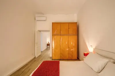 a bedroom with a bed and a wooden cabinet at Vaticano casa tua in Rome
