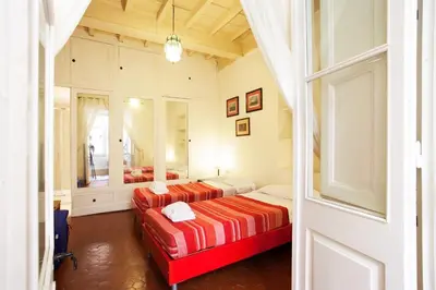 a bedroom with two beds and a window at Passeggiata di Ripetta in Rome