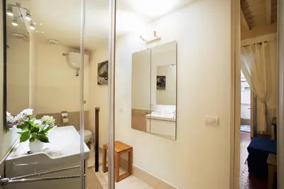 a bathroom with a sink and a mirror at Passeggiata di Ripetta in Rome