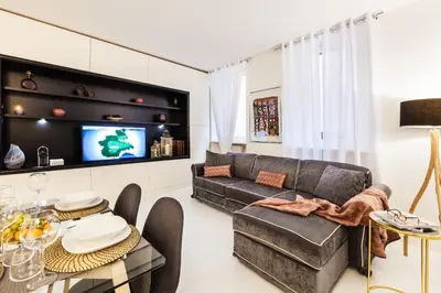 a living room with a couch and a table at Luxury Apartment Casa Farnese – Campo de Fiori in Rome