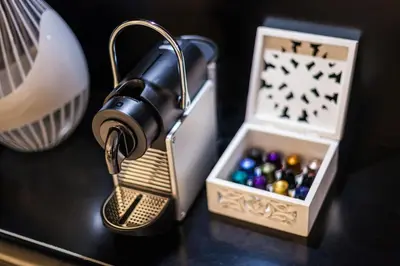 a lamp sitting on a table next to a box of balls at Luxury Apartment Casa Farnese – Campo de Fiori in Rome