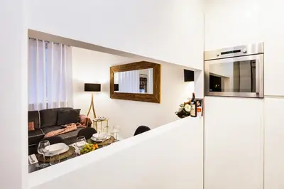 a living room with a couch and a table at Luxury Apartment Casa Farnese – Campo de Fiori in Rome