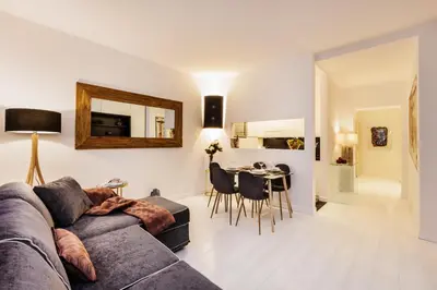 a living room with a couch and a table at Luxury Apartment Casa Farnese – Campo de Fiori in Rome