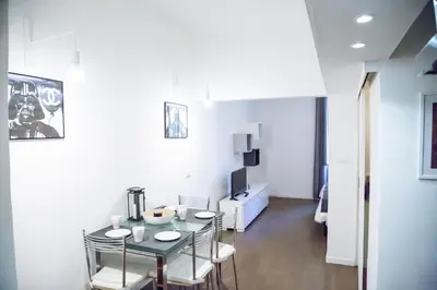 a dining room with a table and chairs at Argentina Exclusive Apartment in Rome