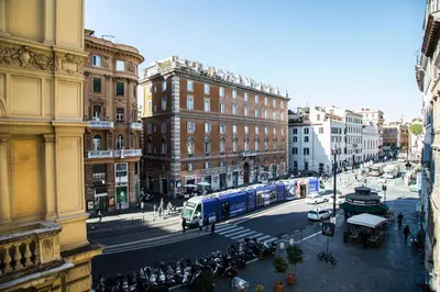 a city street with a bus on a busy street at Argentina Exclusive Apartment in Rome