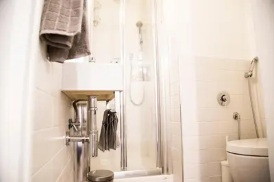 a bathroom with a shower and a sink and a toilet at Argentina Exclusive Apartment in Rome