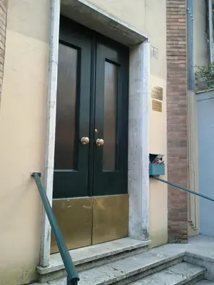 a black door on a building at A Casa Cibella in Rome