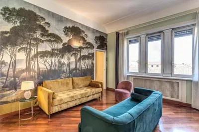 a living room with two couches and a painting on the wall at DOWNTOWN SRL - Imperial Panorama Penthouse in Rome