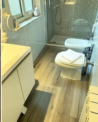a bathroom with a toilet and a sink and a shower at ROMA - Loft Campo de' Fiori - Appartamento Campo de' Fiori - LE CUGINE in Rome