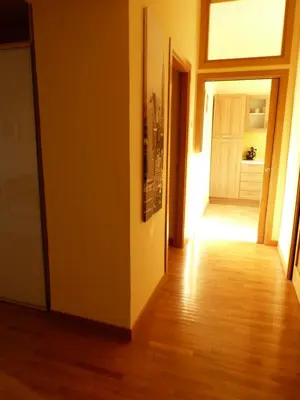an empty hallway with a door and a wooden floor at Lugiadra in Rome