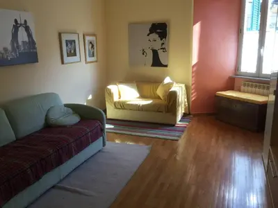 a living room with a couch and a chair at Lugiadra in Rome