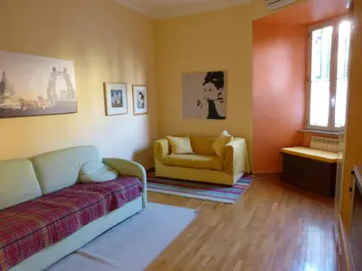 a living room with a couch and a chair at Lugiadra in Rome