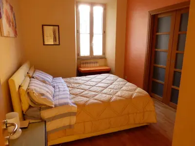 a bedroom with a bed and a window at Lugiadra in Rome