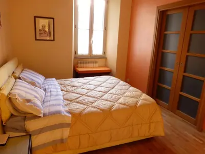 a bedroom with a bed and a window at Lugiadra in Rome