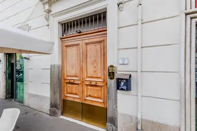 a wooden door on the side of a building at Vatican City Guest House in Rome