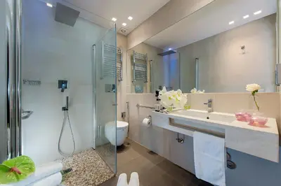 a bathroom with a shower and a sink and a toilet at Hotel Navona in Rome