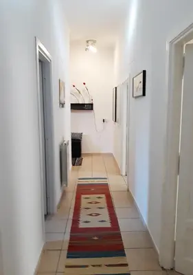 a hallway with a rug on the floor at Il sole del Vaticano in Rome