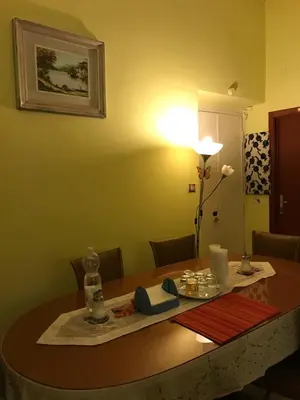 a room with a table with a lamp and a table sidx sidx sidx at B&B Cappellini in Rome