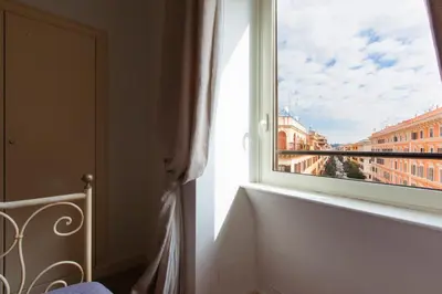 a window in a room with a view of a city at Casa Tranquilli in Rome