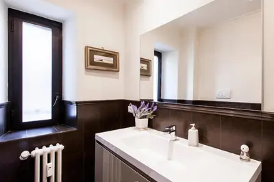 a bathroom with a sink and a mirror at Casa Tranquilli in Rome